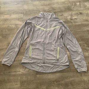 Gray Nike hoodless wind breaker